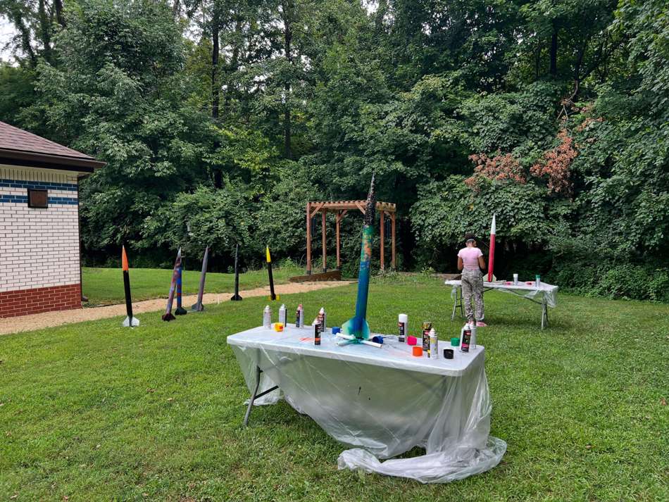 Finished student rockets lined up on a table